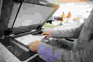 Man making copies on machine