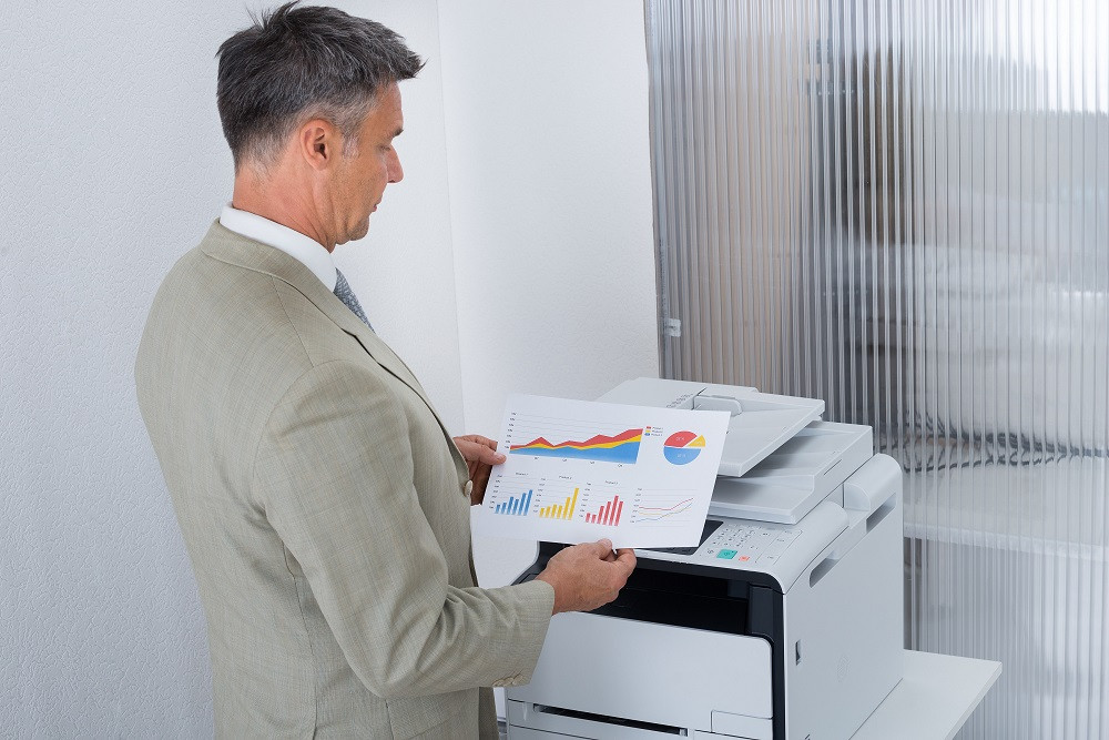 Man Looking at the Printout