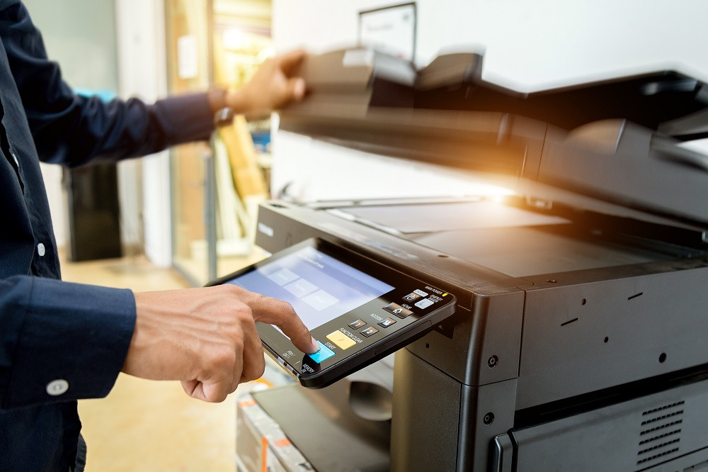 Man Using Copier