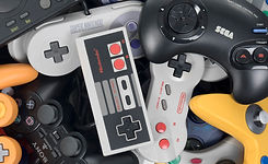 console-wars-pile-of-controllers-1.jpeg