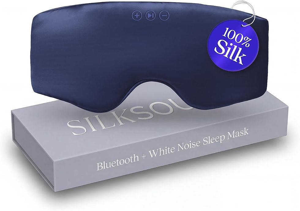 Navy Bluetooth sleep mask with buttons on a gray SILKSOUND box, tagged 100% Silk and Bluetooth + White Noise Sleep Mask.