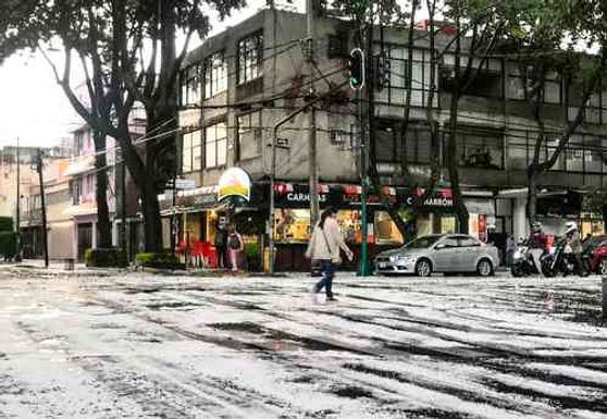 Tormenta, granizo y viento dejan daños y sorprenden a capitalinos