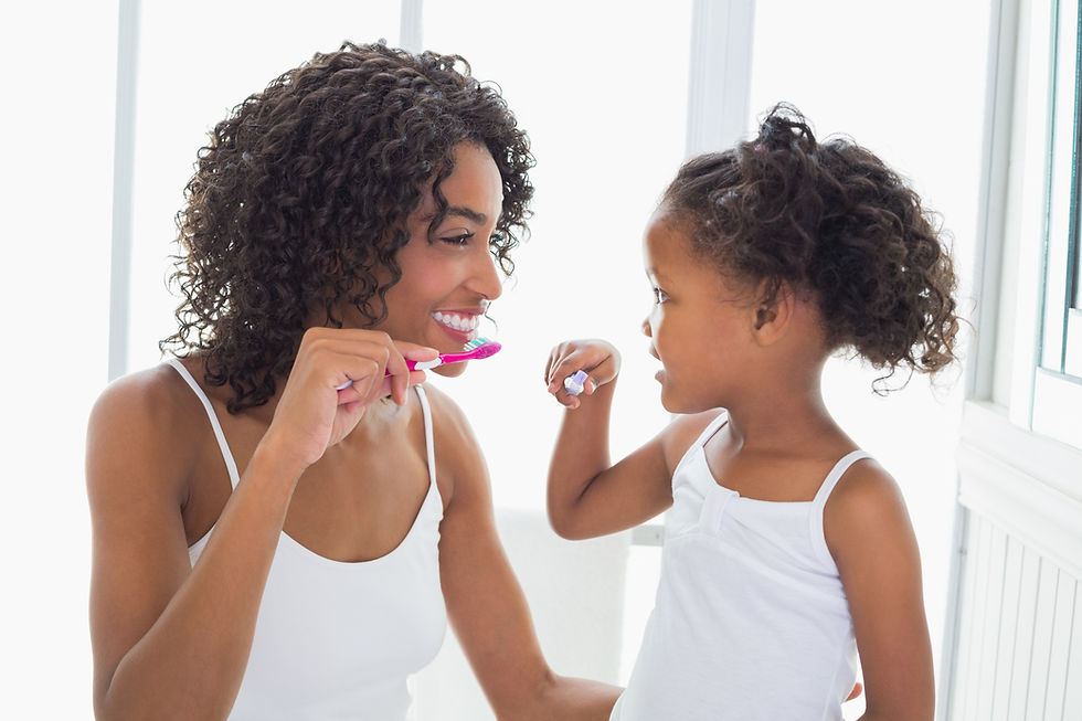 Pretty mother with her daughter brushing