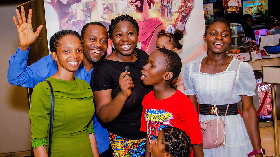 A family at the BFF Lifestyle x Tribe Nation Light of the World Watch Party on Sunday at Ebonylife Cinemas.