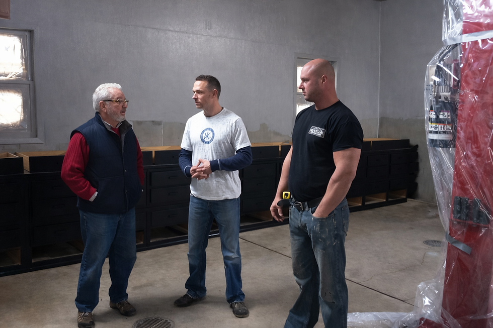 John Johnson (Owner of Revival Interiors) talking with Bob Vila