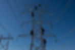 Several linemen climbing a tower