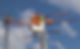 A student working on powerlines covered in orange coverings from a bucket truck bucket