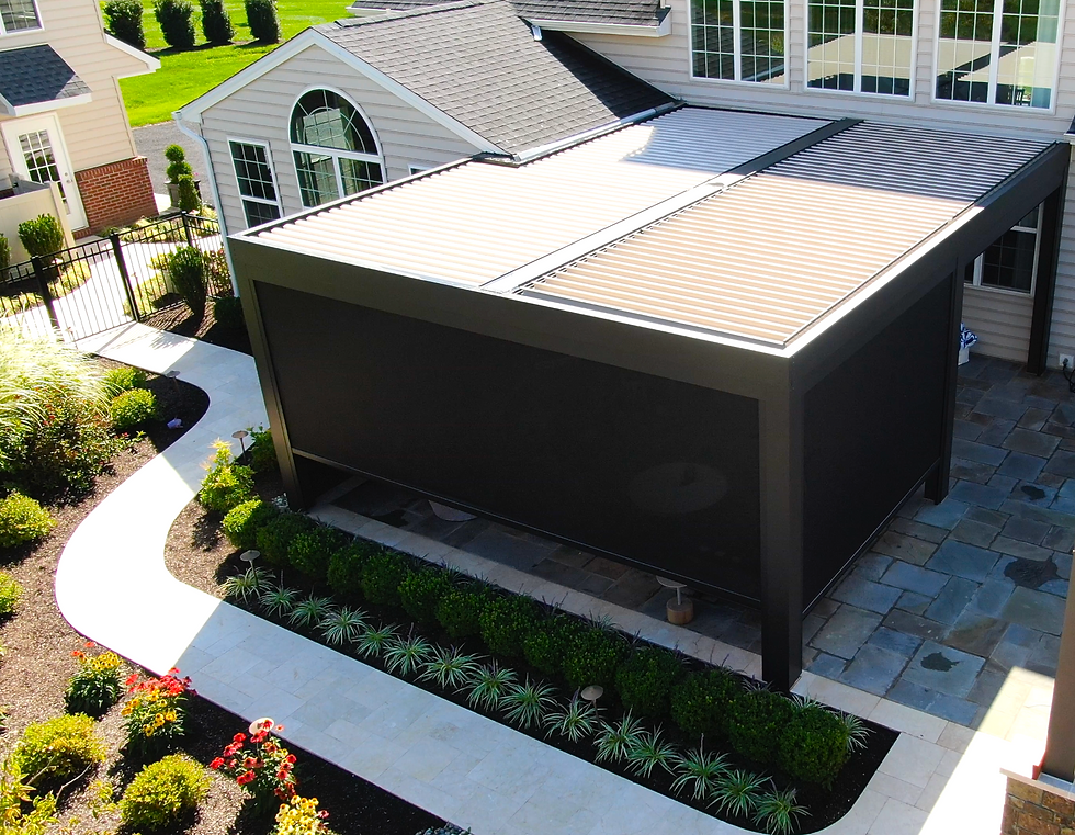 Outdoor privacy screen attached to louvered pergola designed and installed by Distinctive Outdoor Structures.