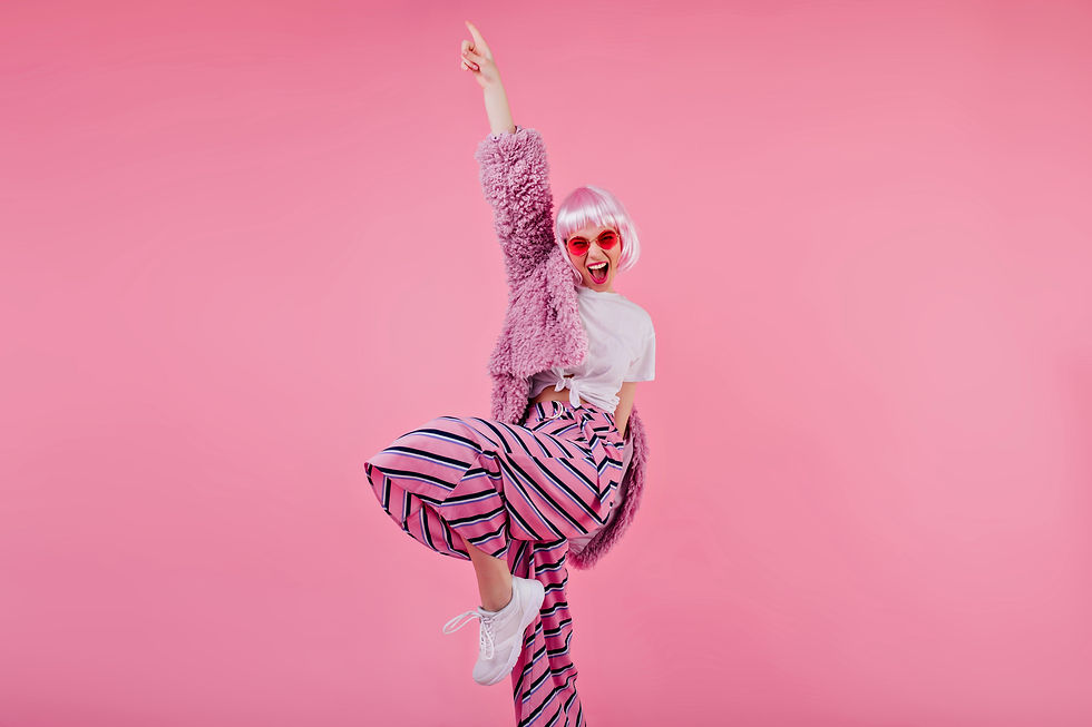 blissful-woman-wears-striped-pants-pink-periwig-laughing-during-photoshoot-confident-young