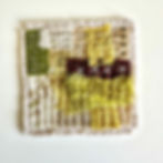 Hands gently slow stitching layers of green and patterned fabric using simple running stitches
