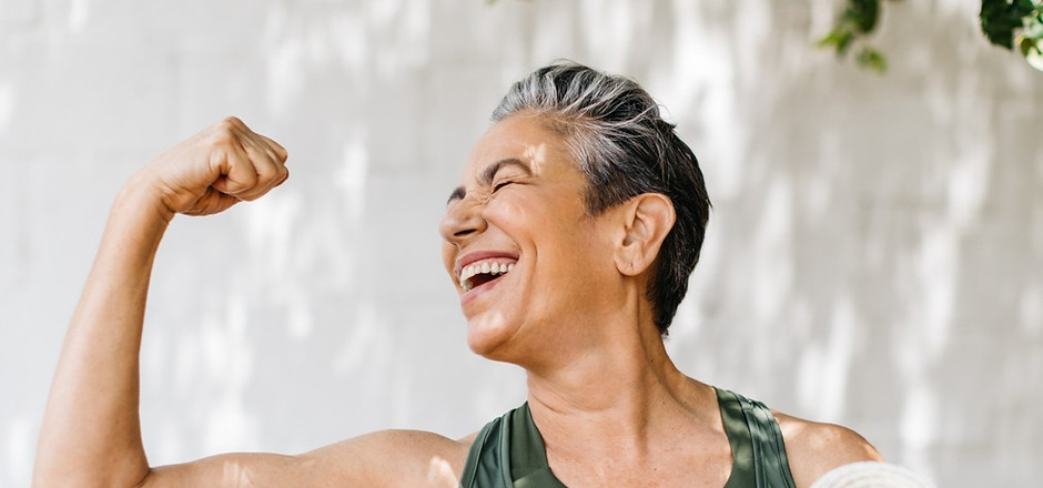 Happy elderly woman celebrating her fitness achievement after a great outdoor workout sess