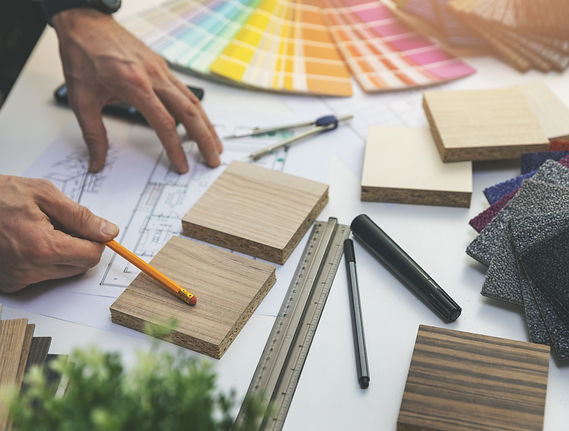 designer choosing flooring and furniture materials from samples for home interior design p