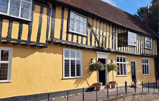Street view of Bildeston Crown tudor beamed building in ochre