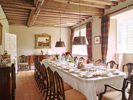 Dining room with table laid out for a banquet in Nedging Hall