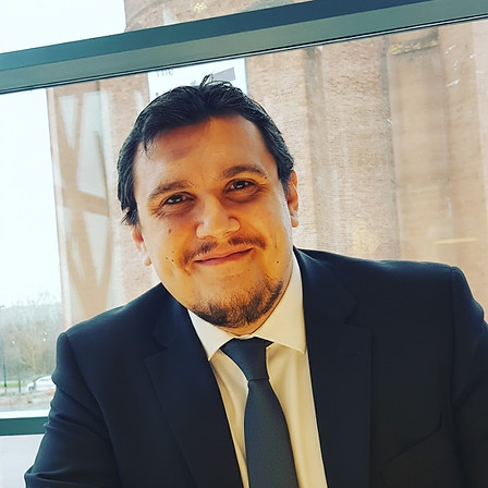 Pietro scano wearing a suit and a tie