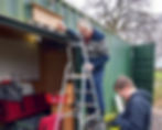 Ian fitting Carl's Shed sign landscape
