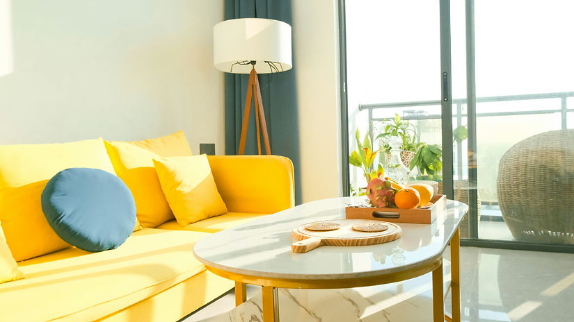 a living room filled with furniture and a large window_edited_edited.jpg