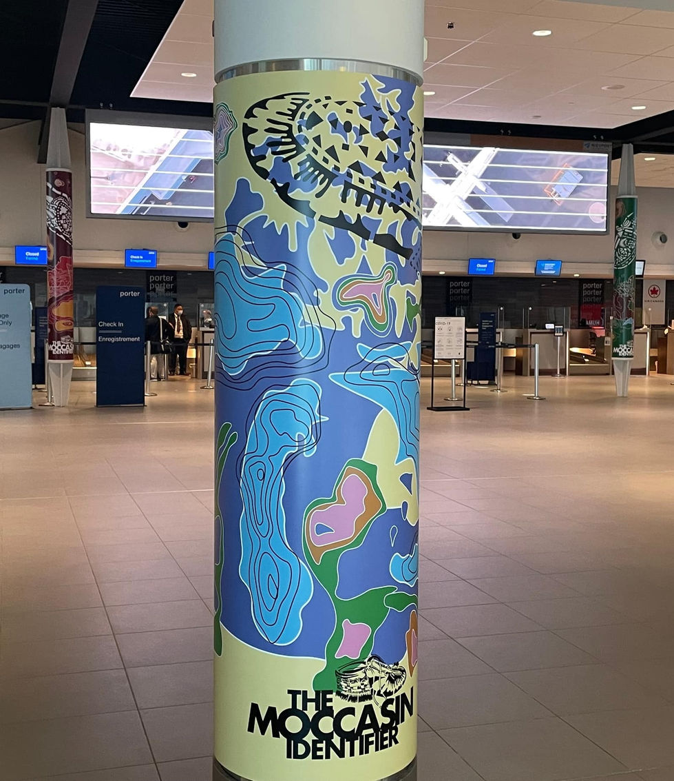 indigenous illustration of canada with moccasin printed on airport pillar