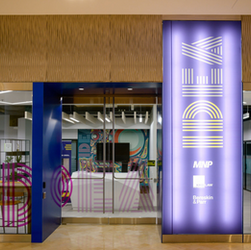 outside of square one office building, with art in window