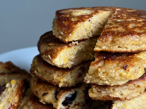 close up of cornbread pancakes on plate