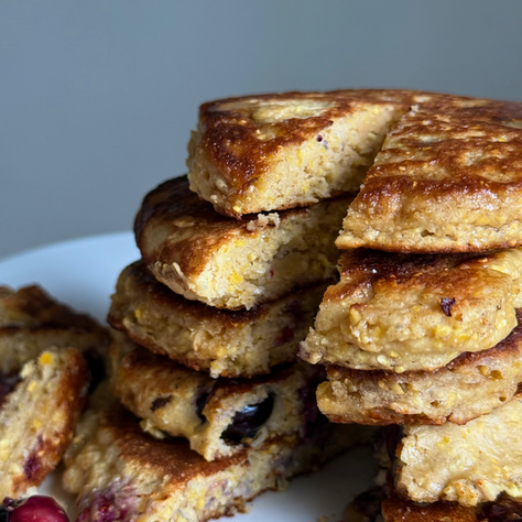 close up of cornbread pancakes on plate