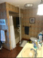 Before image: Bathroom, old wall paper, old toliet, very cramped bathroom.