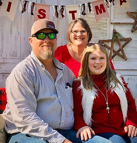 Photo of Natalie Tatsch (FBC Kids Coordinator) posing with family members.