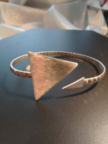 Contemporary sterling silver open style triangle bangle 