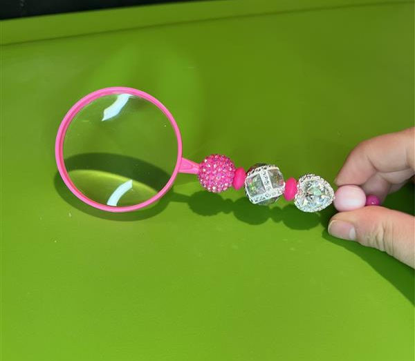 Pink magnifying glass