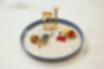 Thumbnail: Miniature cats relaxing in zen garden