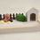 Thumbnail: Miniature dog with house, fence, and grass on wooden tray