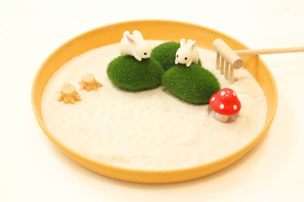Thumbnail: Miniature bunnies in a zen garden with moss, rake, and mushrooms