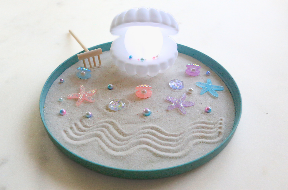 Thumbnail: Miniature zen garden with glowing clam shell