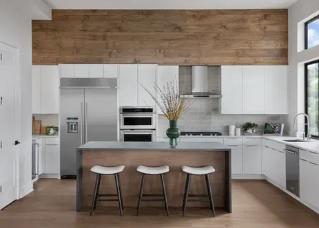 Modern kitchen with white cabinets, wood panel wall, and island