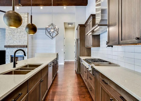 Modern kitchen with island and open living space.