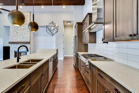 Modern kitchen with island and open living space.