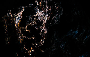The Amazon Warrior Queen by Roee Baldinger (Cerno Argus). High-contrast fine art photography of a jagged, fragmented rock structure shaping a stoic female profile with a sharp crown-like formation. Part of the Psychosis of a Matter sub-series.