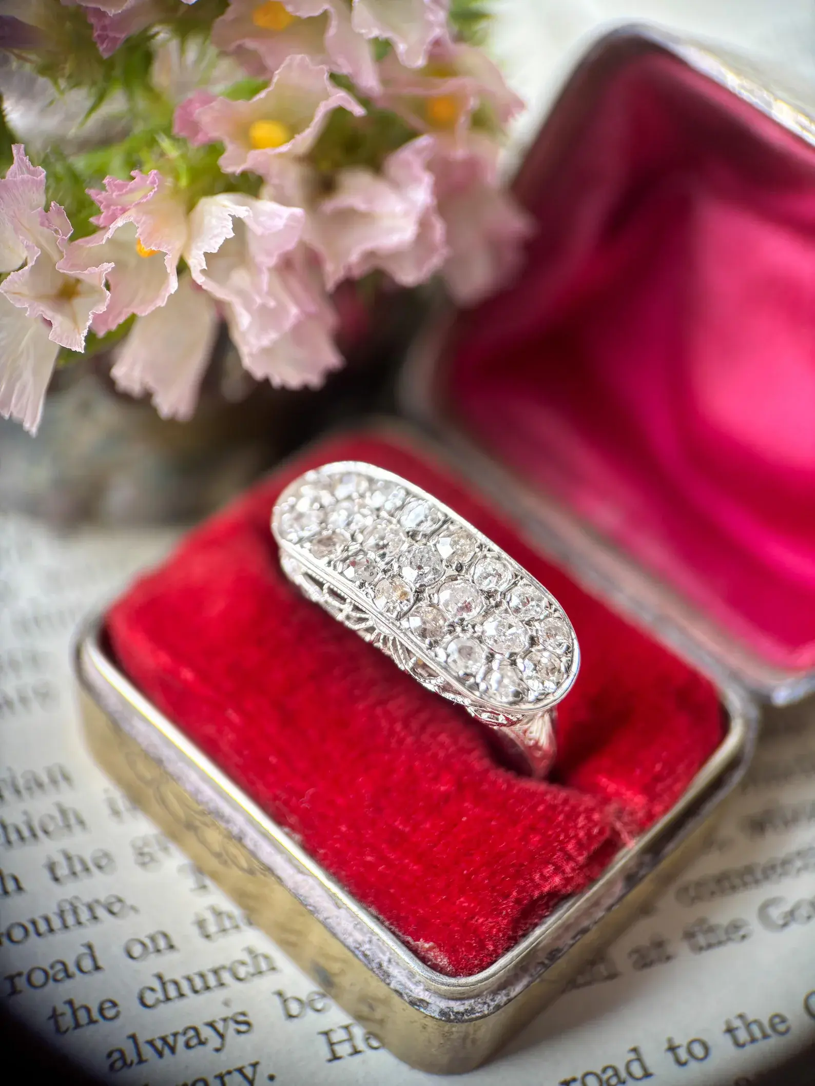 An 18ct white gold and diamond filigree ring