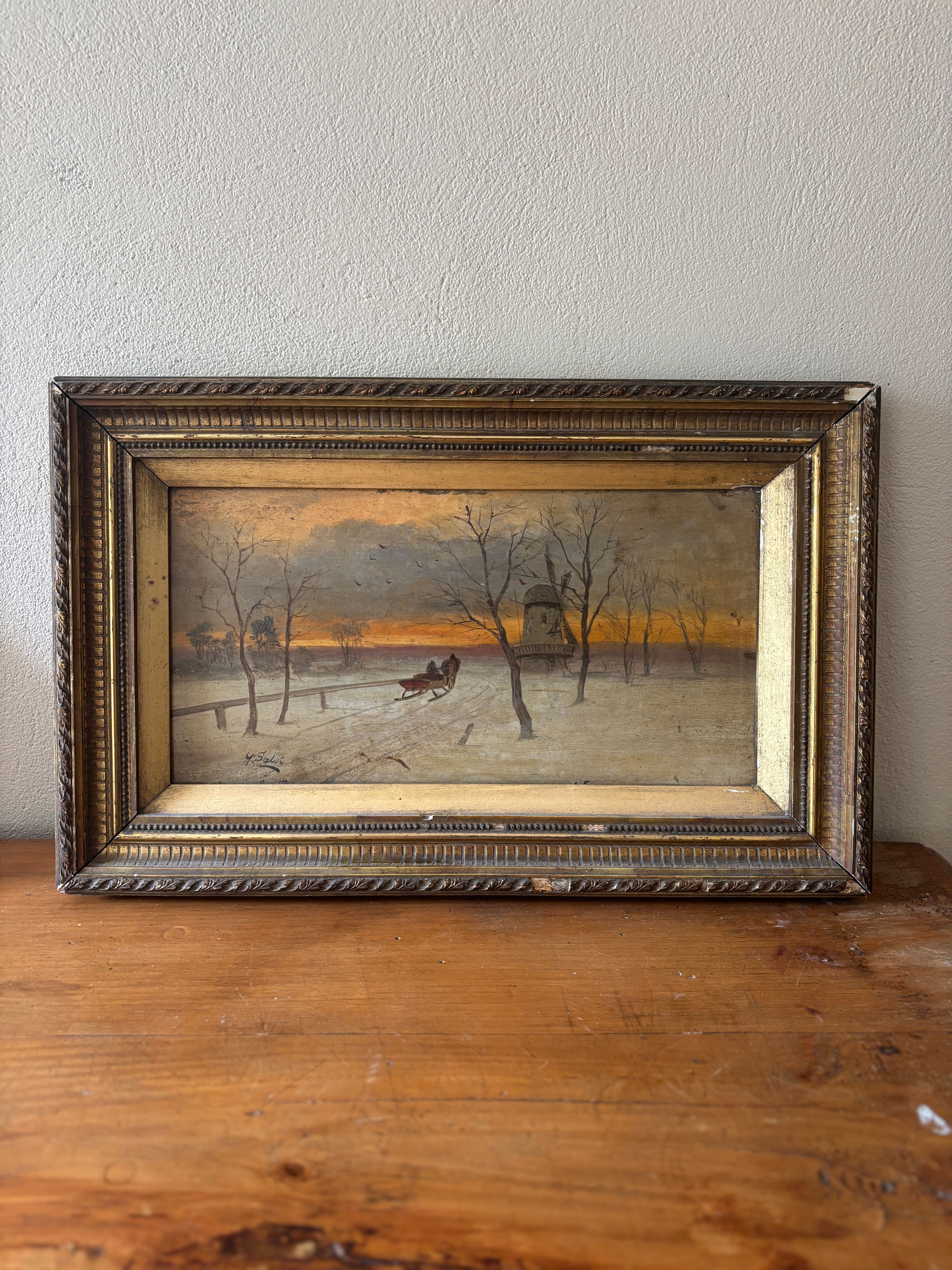 Antique winter landscape oil painting by G. Salvi depicting a horse-drawn sleigh crossing a snowy countryside at sunset