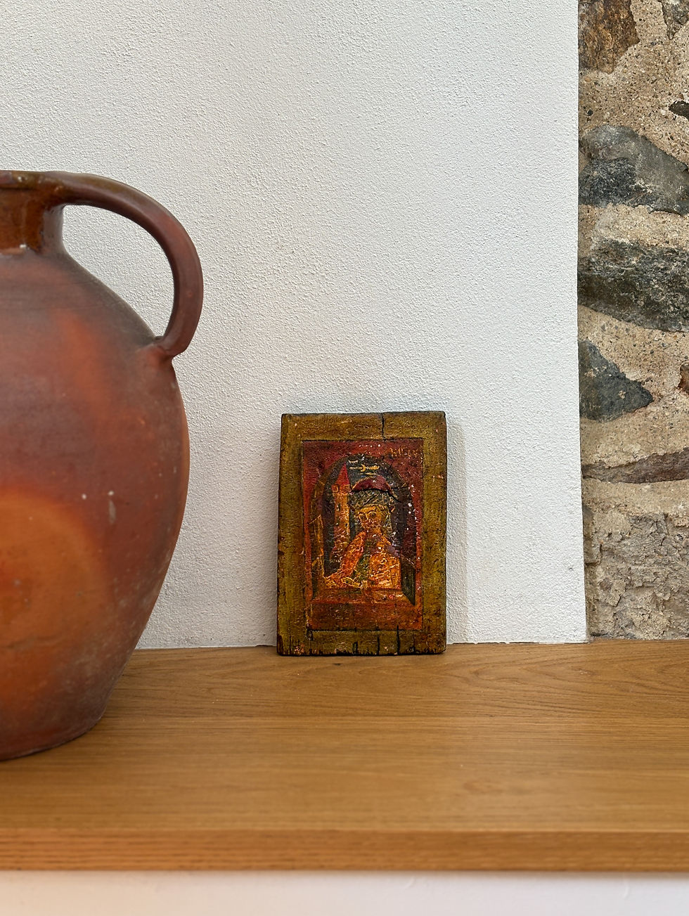 Late 17th to early 18th century Central European devotional panel depicting a haloed saint before Gothic architecture, painte