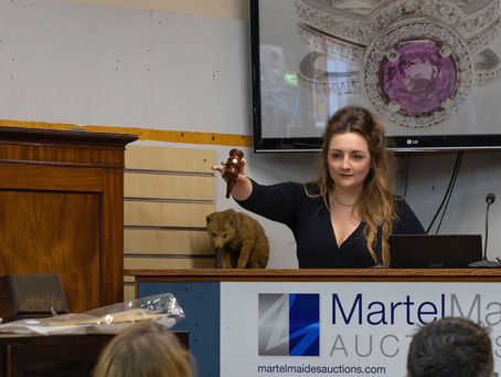Our founder, Camille, auctioneering in Guernsey