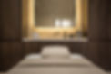 a spa room with a bed and soap in the background
