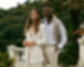 a stylish woman and man standing side by side on a Italian looking deck