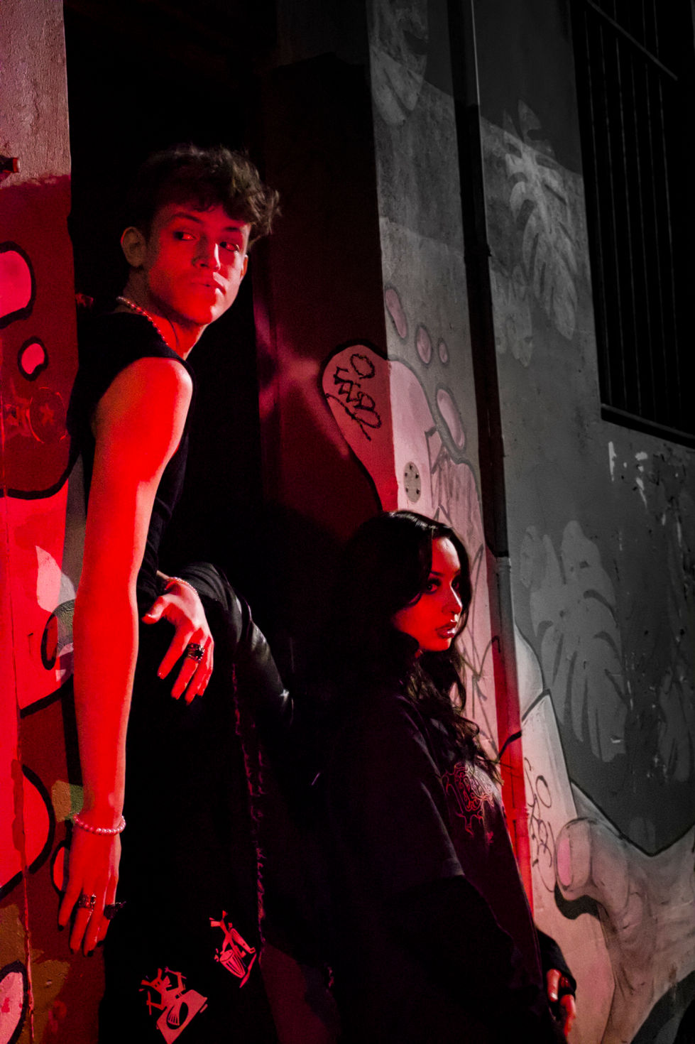 Neon lights at night shining on models down perth city alley