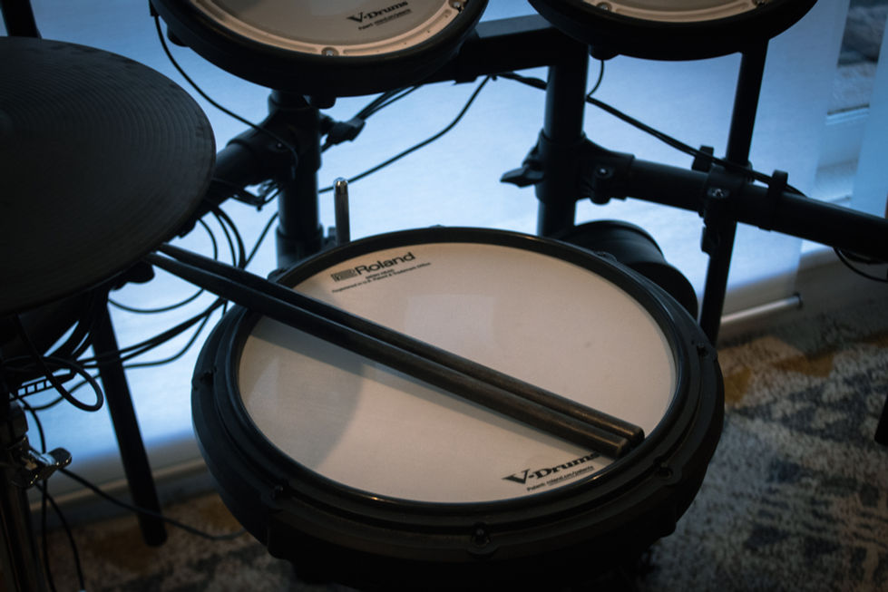 Drumstick placed on drums