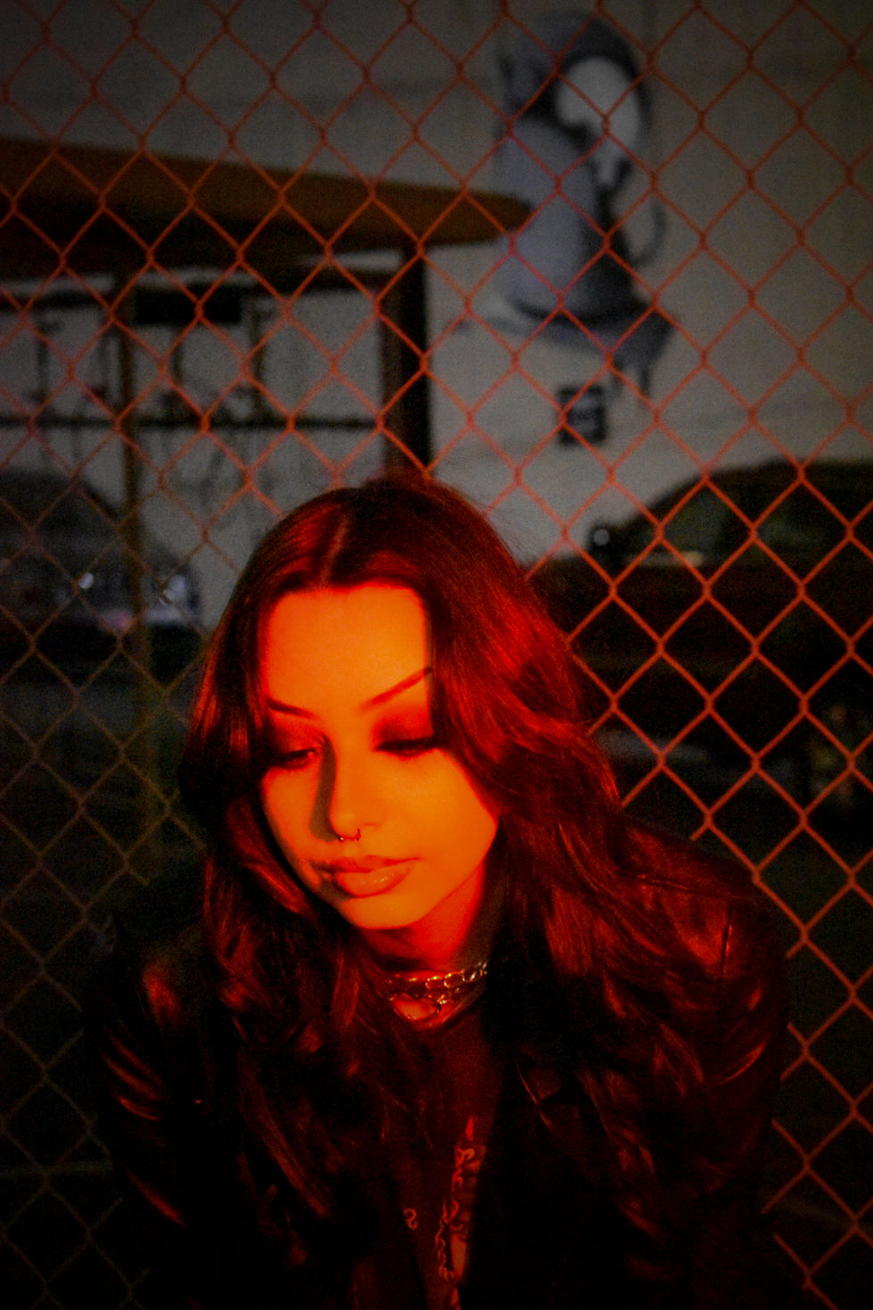 Neon lights at night shining on model close up looking down