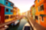 beautiful-sunset-with-boats-buildings-water-sun-light-toning-burano-italy.jpg