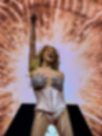 Kesha performing live onstage.