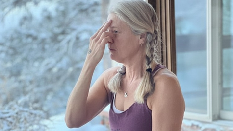 A woman doing yoga.