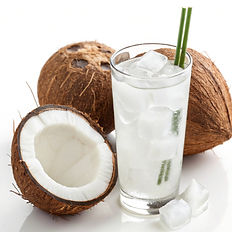 Fresh coconut with a glass of coconut water
